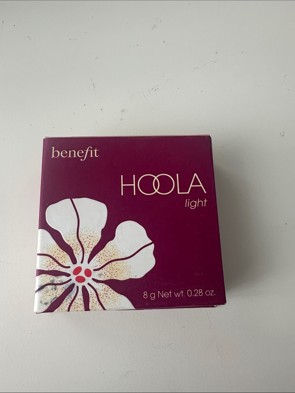 Benefit Hoola Light Bronzer - Plum Packaging with White Floral Accent